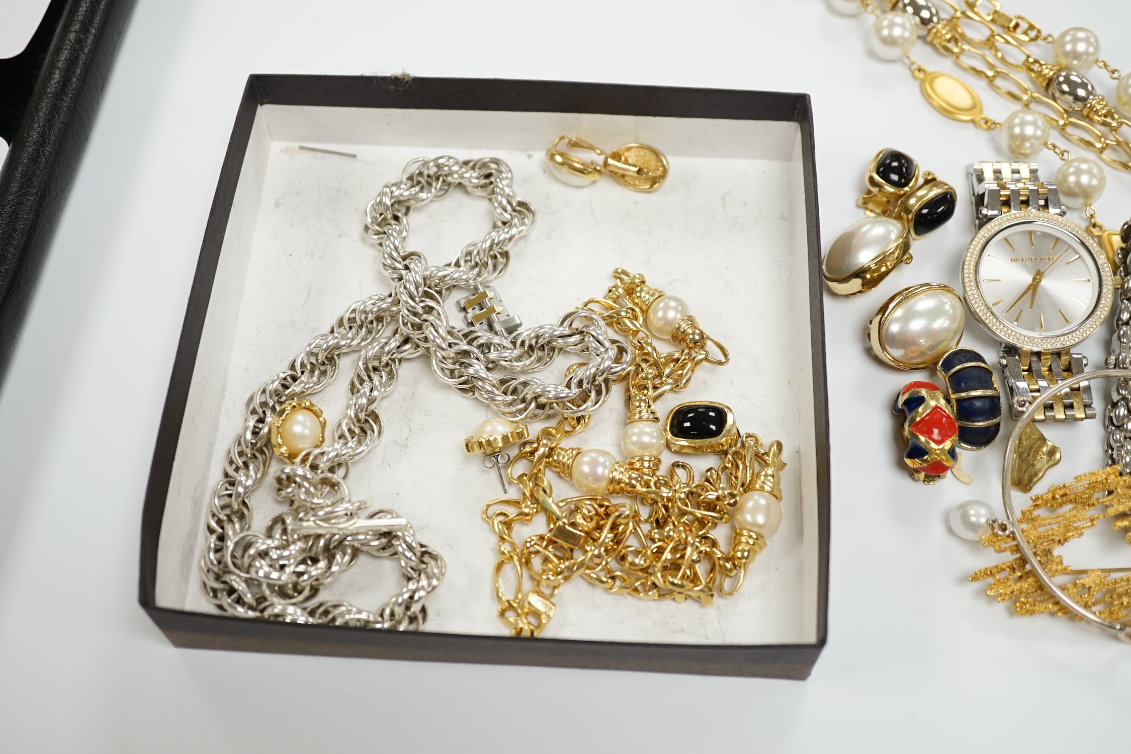 Two Christian Dior necklaces and three pairs of Dior ear clips, together with other signed pieces of costume jewellery.